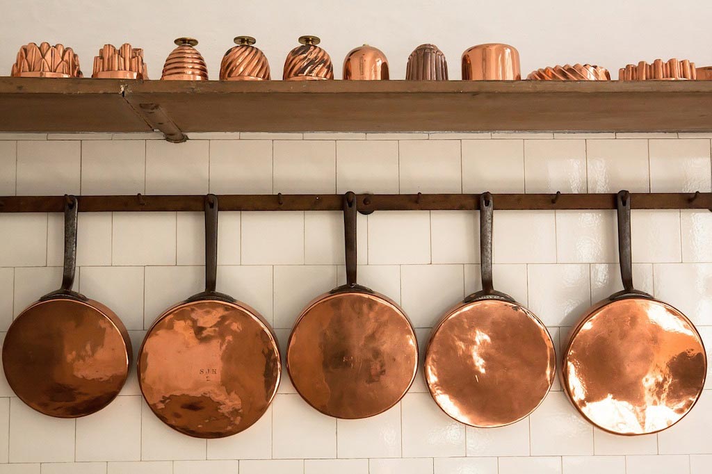 Copper-accessories-on-white-tiled-splashback-wall-in-an-Adelaide-kitchen